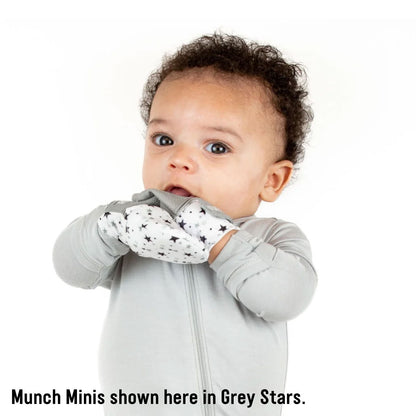 Munch Mini Mitts with baby wearing grey stars patterned mitts